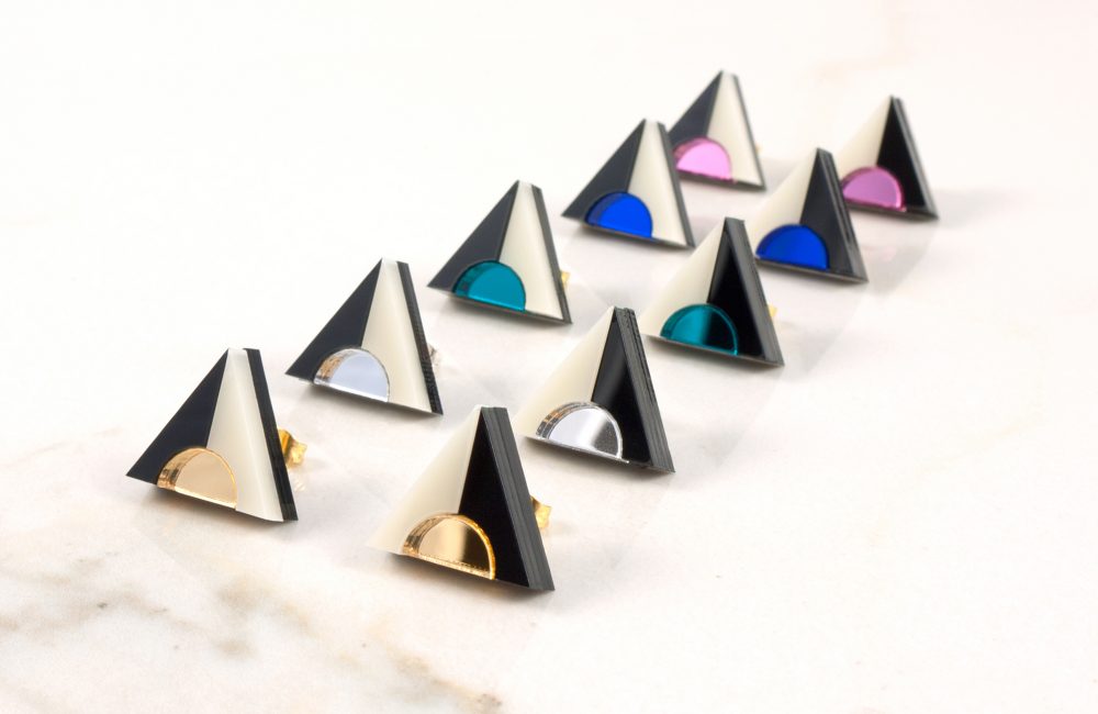 Row of triangle acrylic stud earrings