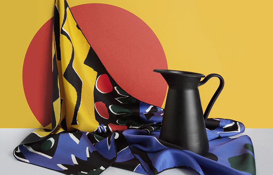 Brightly coloured silk scarf with a black jug