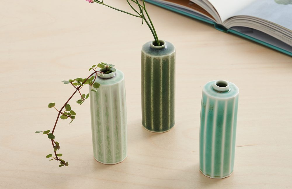 Three miniature green pots